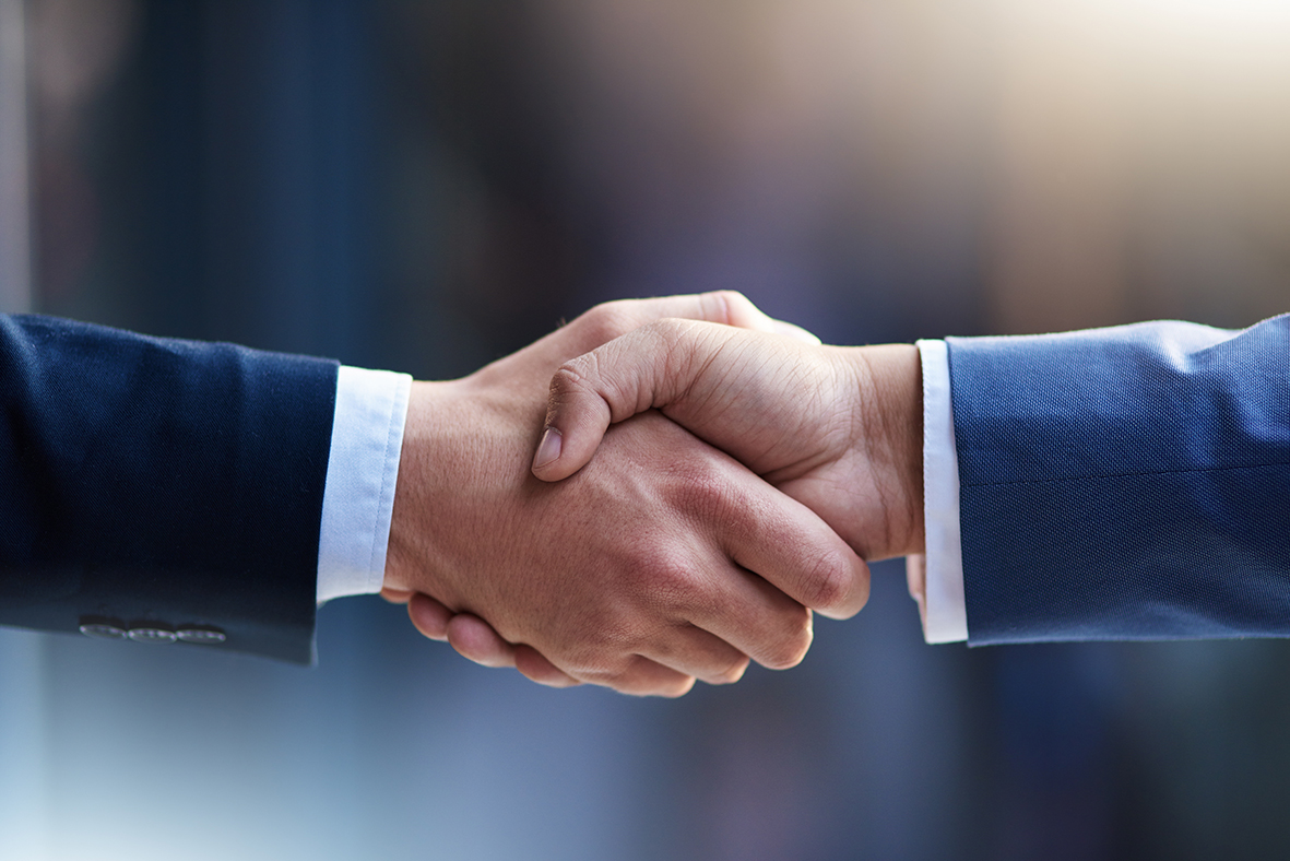 Handshake between two people in suits